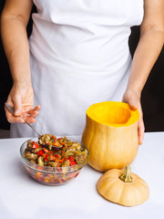 Cooking pumpkin stuffed with meat and vegetables
