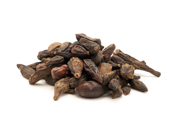 Pile of Organic Chebulic Myrobalan or Choti Harad (Terminalia chebula) isolated on white background.