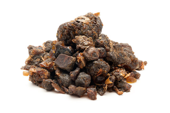 Pile of Organic Indian bdellium or Guggul resin (Commiphora wightii) isolated on white background.