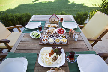 Rich and delicious Turkish breakfast on wood table