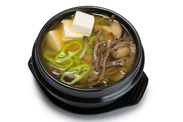 Mushroom soup with vegetables, beef and tofu