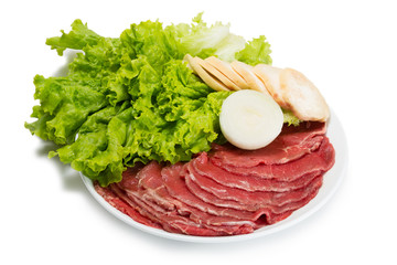 Raw fresh thinly sliced meat with lettuce