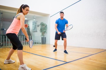 Fototapeta na wymiar Couple play some squash together