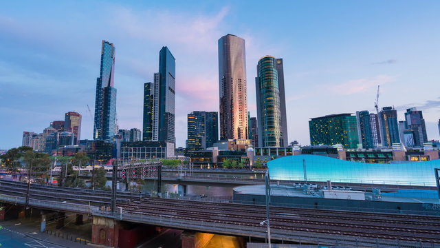 4k timelapse video of railway and office buildings in Melbourne CBD from sunset to night