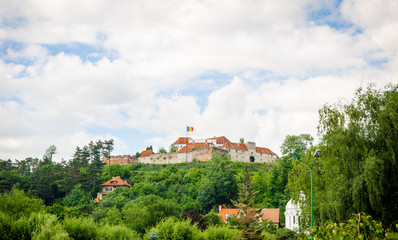 MEdieval fortress of Brasov walls in Transylvania region of Romania with high defence walls and towers suggesting the country's rich historic and cultural heritage