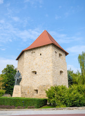 Tailors' Bastion in Cluj Napoca city, Transylvania region of Romania. A medieval defence tower with the statue of national hero General Baba Novac in the front