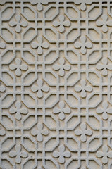 Floral and geometric stucco work on an exterior wall in romania with a lot of detail on white plaster