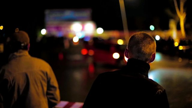 People Watching Car Drifting At Night