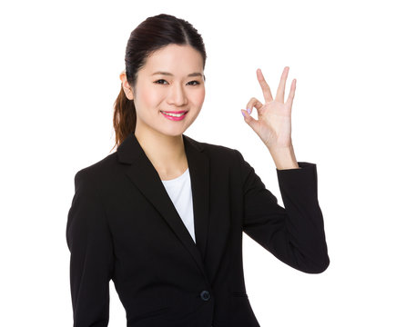 Businesswoman show with ok sign gesture