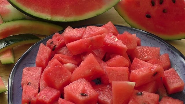 Fresh water melon pieces in blue bowl 
