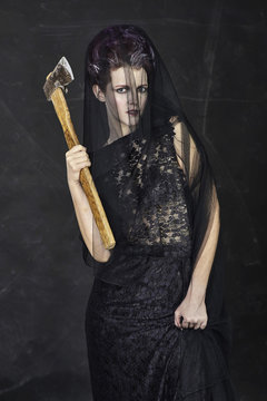 Mourning Widow holding an Axe