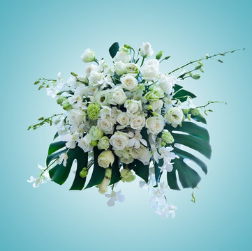 Fototapeta white roses arrangement on light blue background with working pa