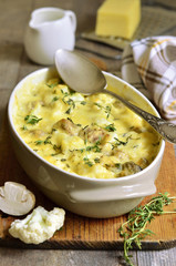 Baked cauliflower with mushrooms.