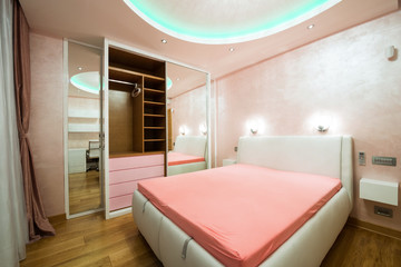 Interior of a modern bedroom with luxury ceiling