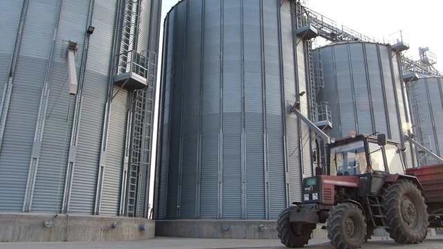 Tractor and agricultural silo