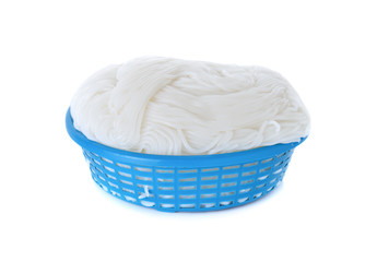 rice vermicelli or Thai noodle in plastic basket on white backgr