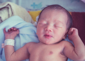 New born Asian baby infant in a hospital.