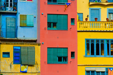 Obraz na płótnie Canvas Close up of colorful old houses and windows. Girona, Spain. Colo