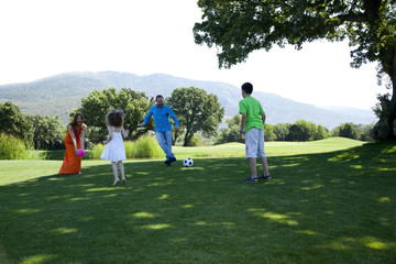 Happy family is enjoying at park on a weekend day all together