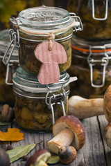 Preparation kitchen mushrooms marinated jars wooden table