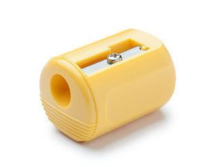 Yellow pencil sharpener on white background