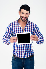 Portrait of a smiling man showing tablet computer screen