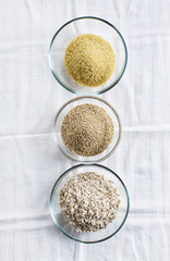 Cereals in bowls : Oats, Couscous, Quinoa