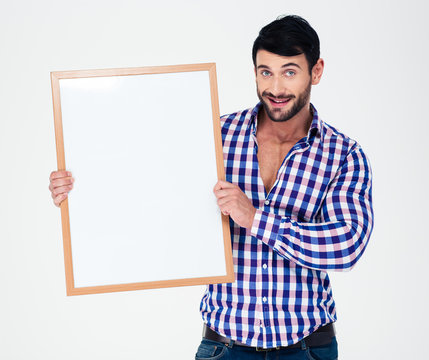 Smiling man holding blank board