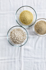 Cereals in bowls : Oats, Couscous, Quinoa