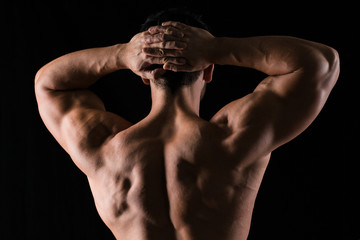 Fototapeta na wymiar Back view portrait of a muscular man