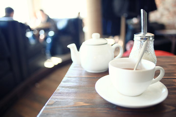 cup of tea at a cafe blurred background