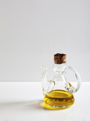 Extra virgin olive oil, a glass with olive oil isolated on white