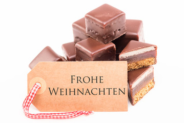 Frohe weihnachten Schild mit Dominosteinen