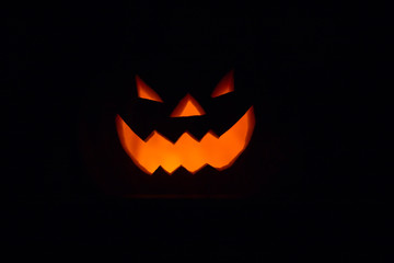 Halloween - old jack-o-lantern on black background