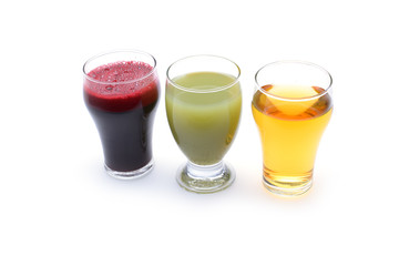 Fresh fruit and vegetable juices on white background