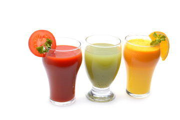 Fresh fruit and vegetable juices on white background