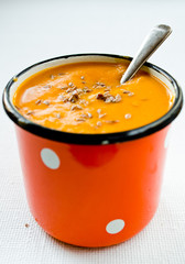 Vegetarian carrot-pumpkin cream soup with flax seeds