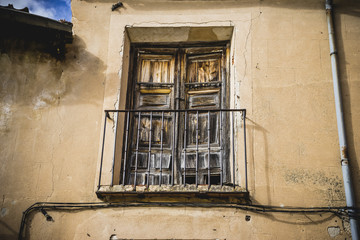 Traditional architecture with balconies and old windows, city of