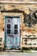 Fototapeta na wymiar old ancient door with old grunge brick wall