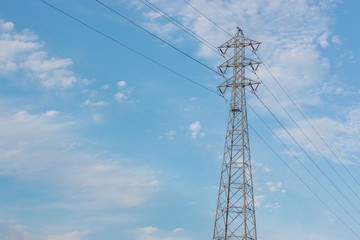 Fototapeta premium Mast electrical power line against cloud and blue sky.