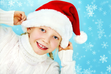 Smiling girl in Santa hat