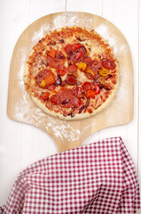 stone baked pizza on wooden board