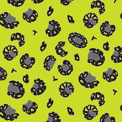 Pattern with the image of spots of a leopard\Pattern with the image of spots of a leopard from words on a lime background