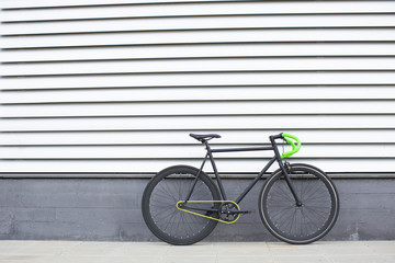 Fototapeta na wymiar Fixie bike on urban background. Fixed bike.