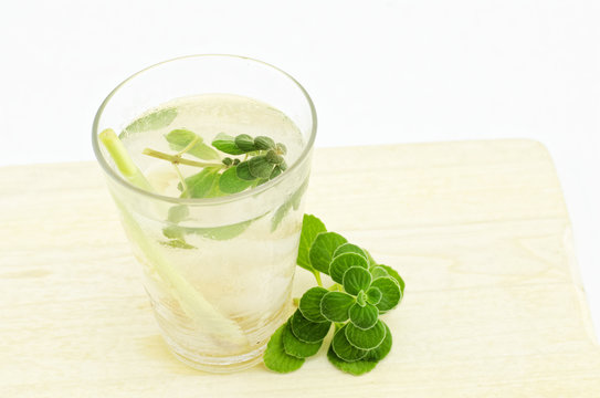 homemade cold soda drink with lemon grass, lychee.mint on wood tray isolated white background