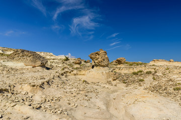 Fototapeta na wymiar Picturesque mountains and rocks of unusual bizarre in Sarakiniko, Milos, Cyclades, Greece.