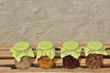 Jars with fruity compotes . Preserved fruits.