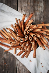 Brown Cinnamon Sticks in a Mortar. Rustic style, top view