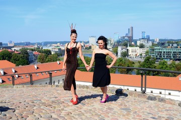 Naklejka premium Beautiful girls in Vilnius town Gediminas castle hill
