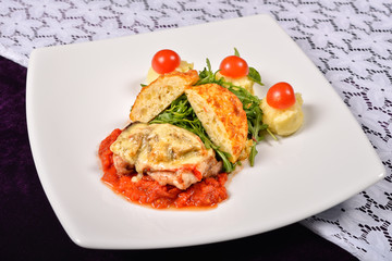 pork rind cheese with tomato and pepper sauce, mashed potatoes,